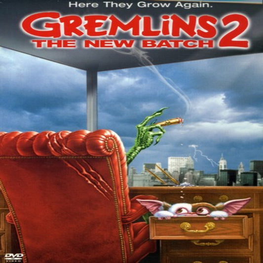Movie poster for 'Gremlins 2: The New Batch' with a red armchair and green creature.