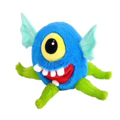 A plush toy resembling a stylized blue monster with a single large eye, white teeth in a smiling mouth, green limbs, and wing-like structures on its back.